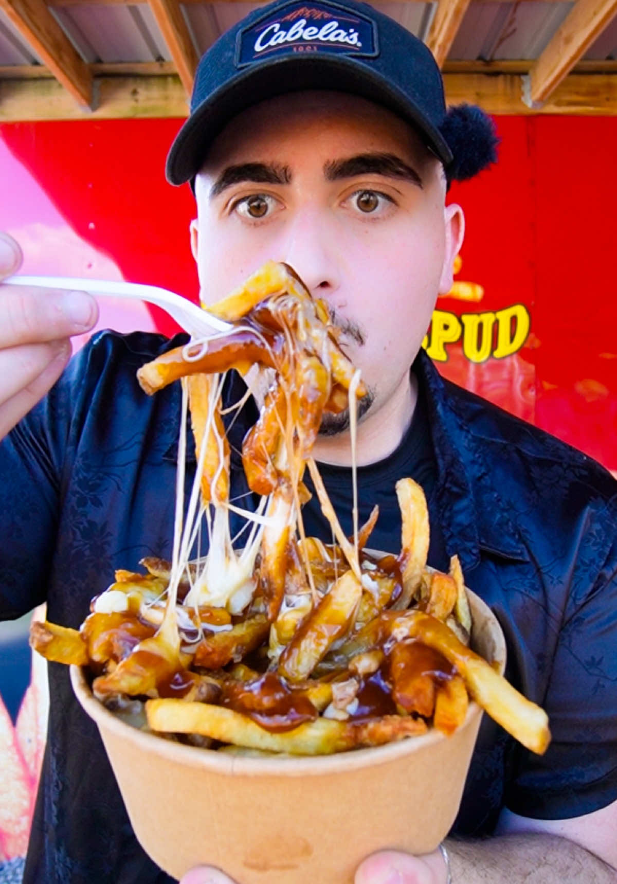 TikTok video review — customer trying The Crispy Spud poutine
